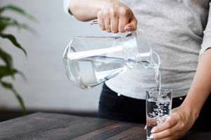 woman-pouring-glass-of-water
